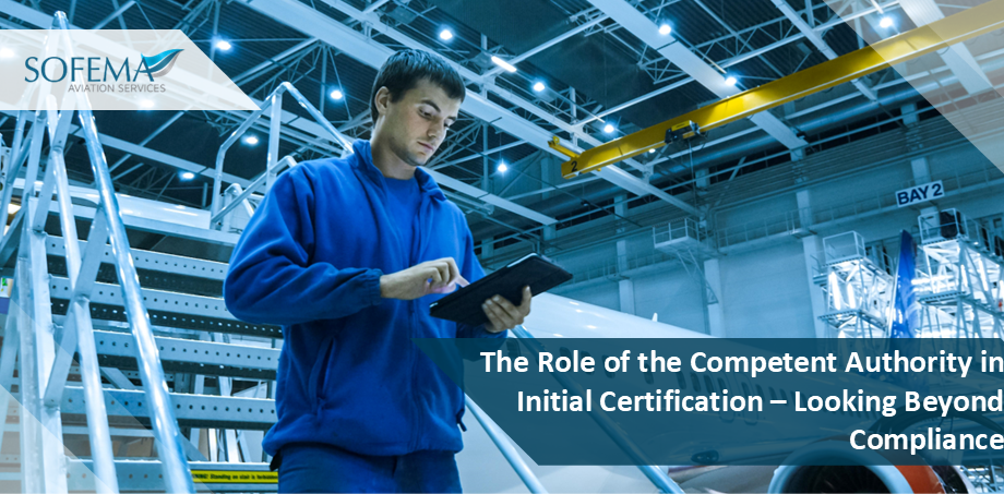 A man in blue overalls uses a tablet in an aircraft hangar, with text overlay "The Role of the Competent Authority in Initial Certification - Looking Beyond Compliance."
